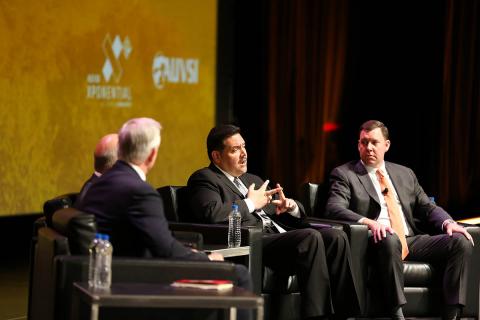 Andrew Velasquez III, managing deputy commissioner of the Safety and Security Division of CDA, second from right, and Matt Cornelius, EVP of Airports Council International - North America, discuss the task force at AUVSI Xponential 2019. Photo: Becphotogr